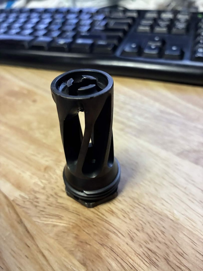 Muzzle device length is 2.3 inches, length added to the barrel is 1.7 inches (on barrels with 0.6" t